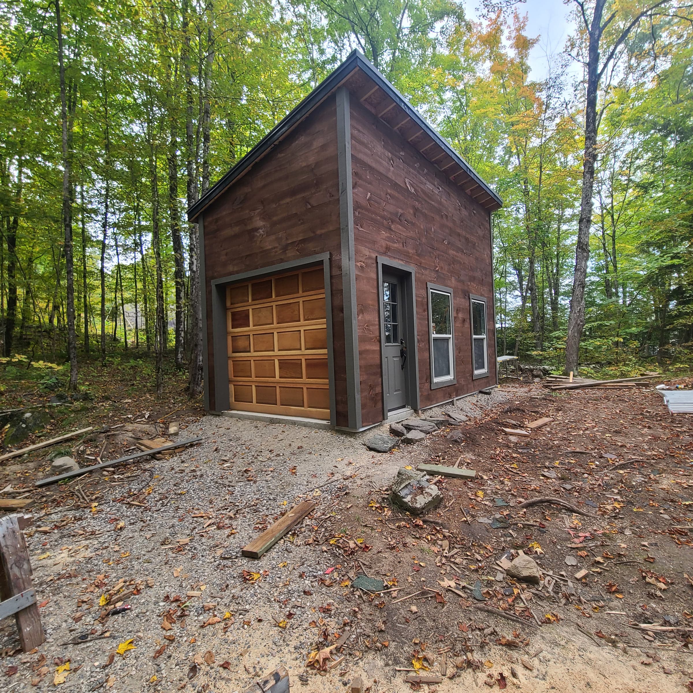 Finished brick outbuilding in a wooded setting