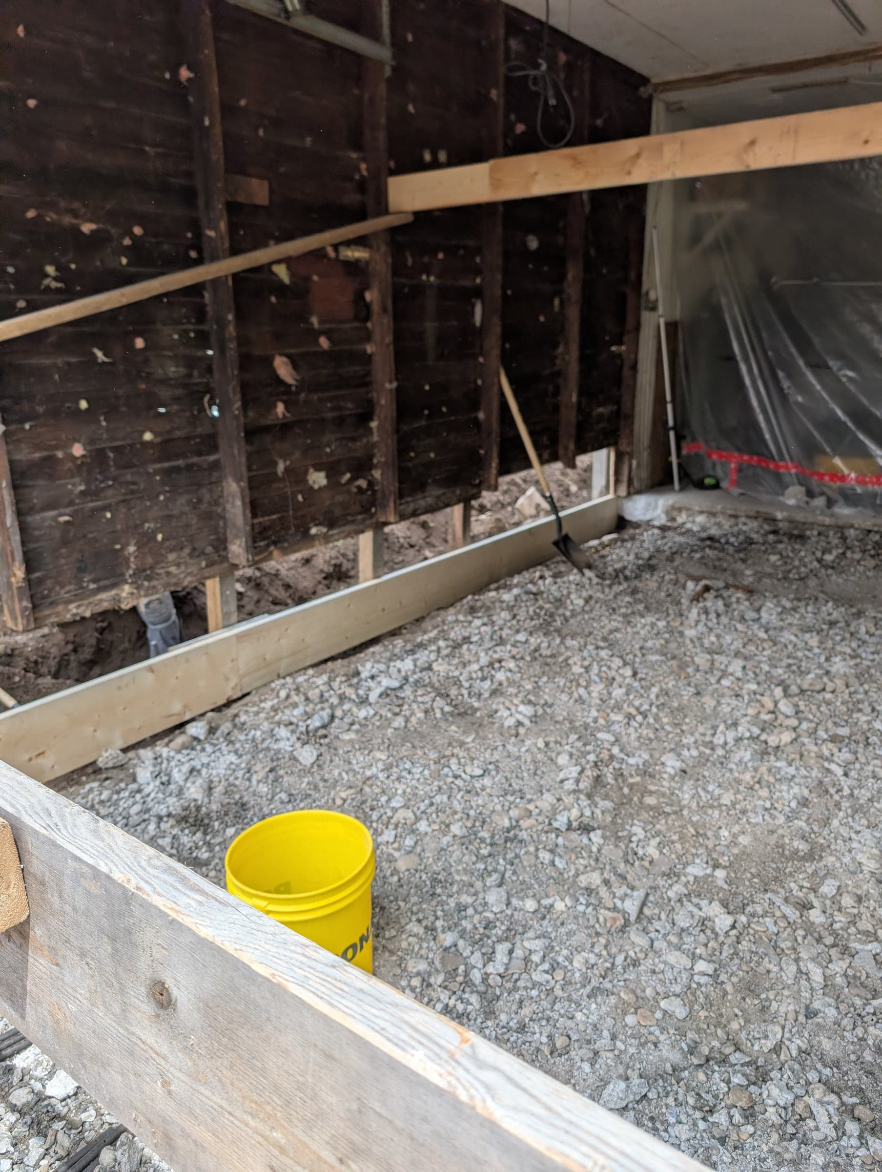 Outdoor slab area prepared with forms, gravel, and reinforcement